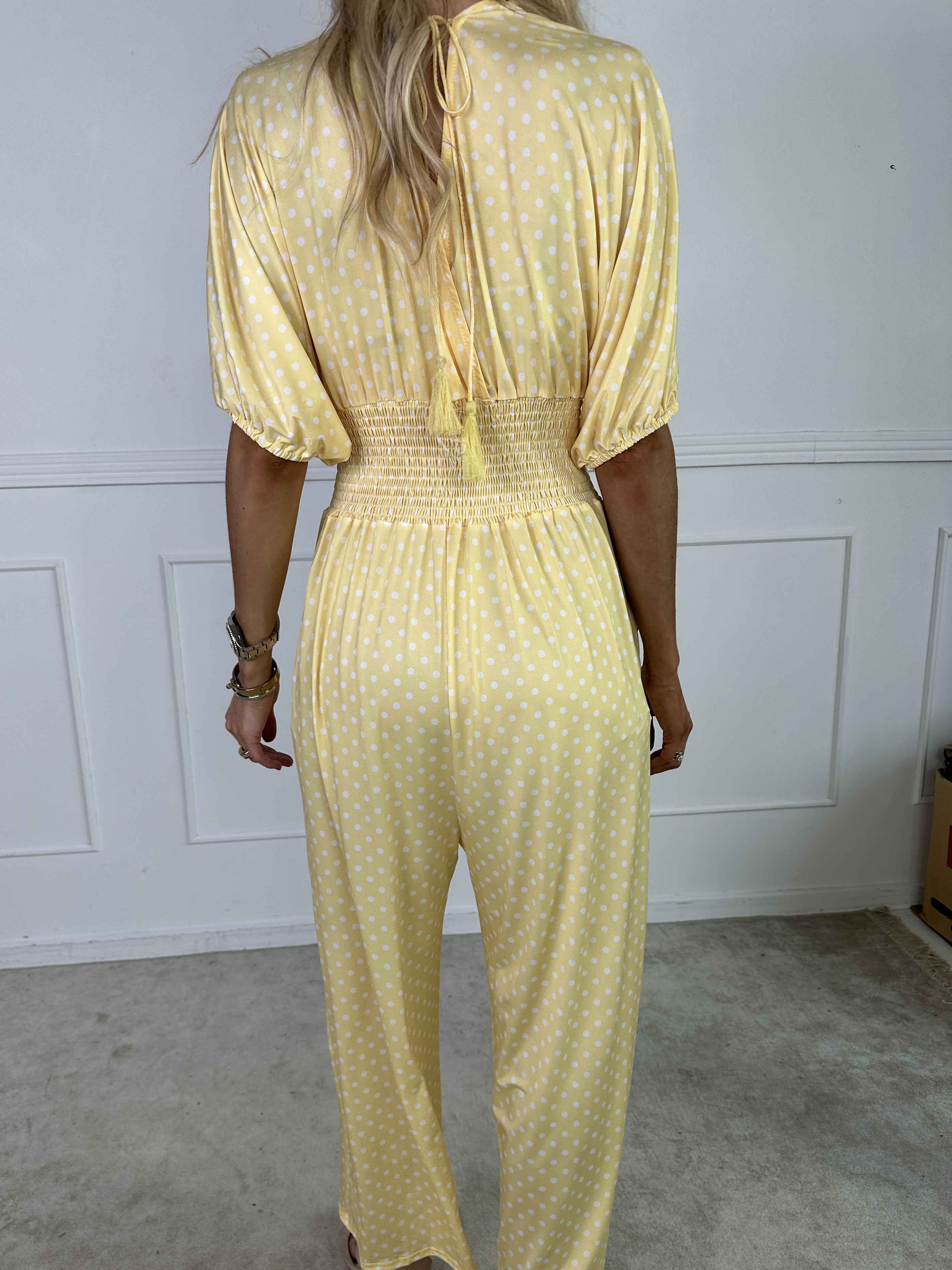 Grace - Stretchig jumpsuit med vita prickar